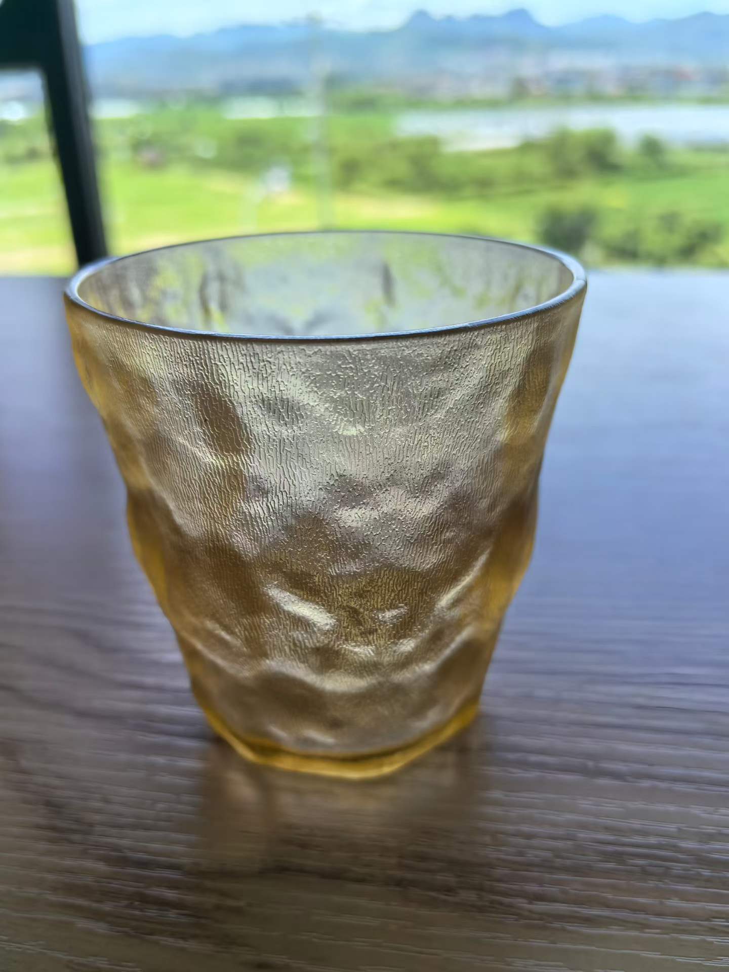 detail wrinkle textured amber acrylic water cup close view